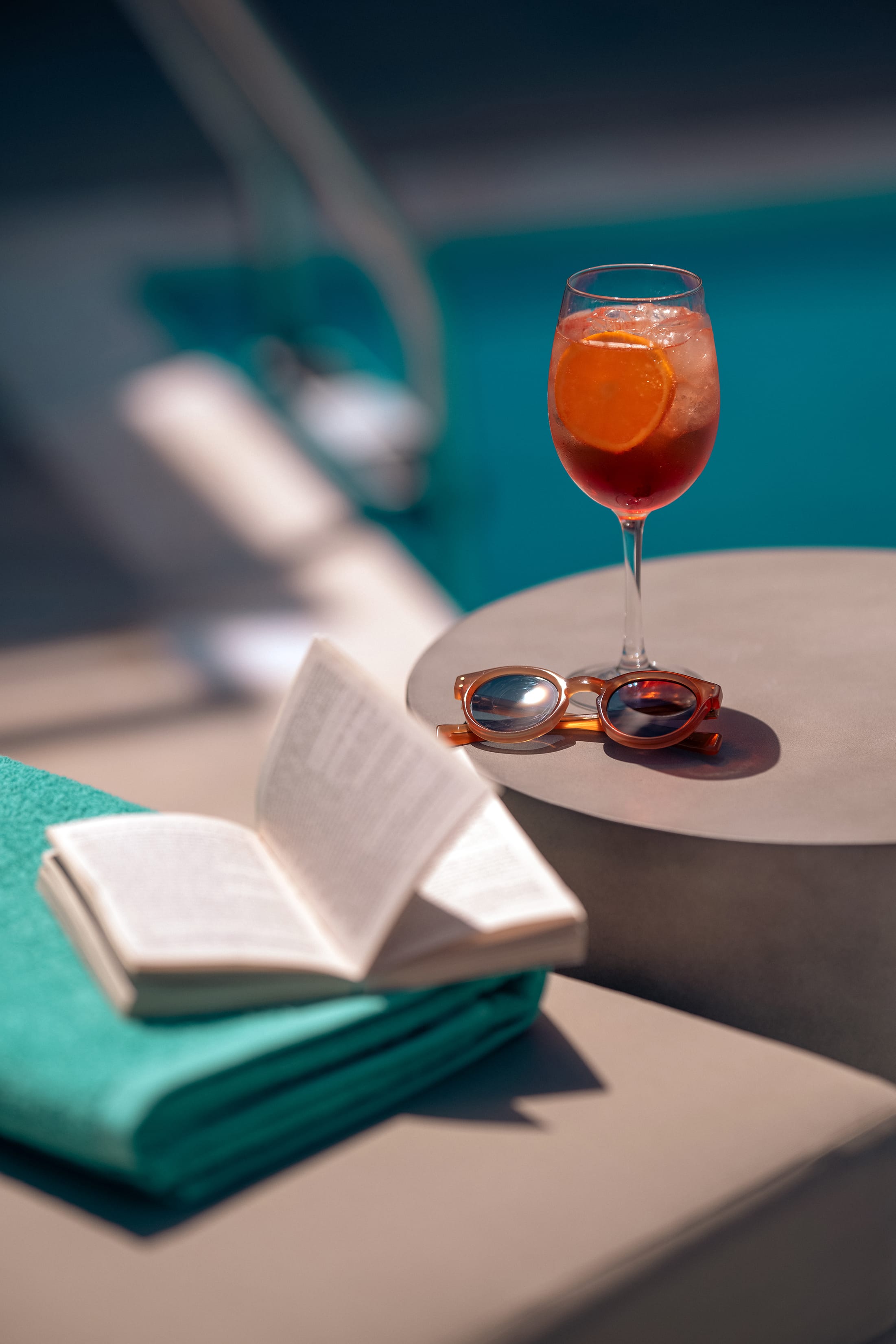 a glass of wine and a ring on a table