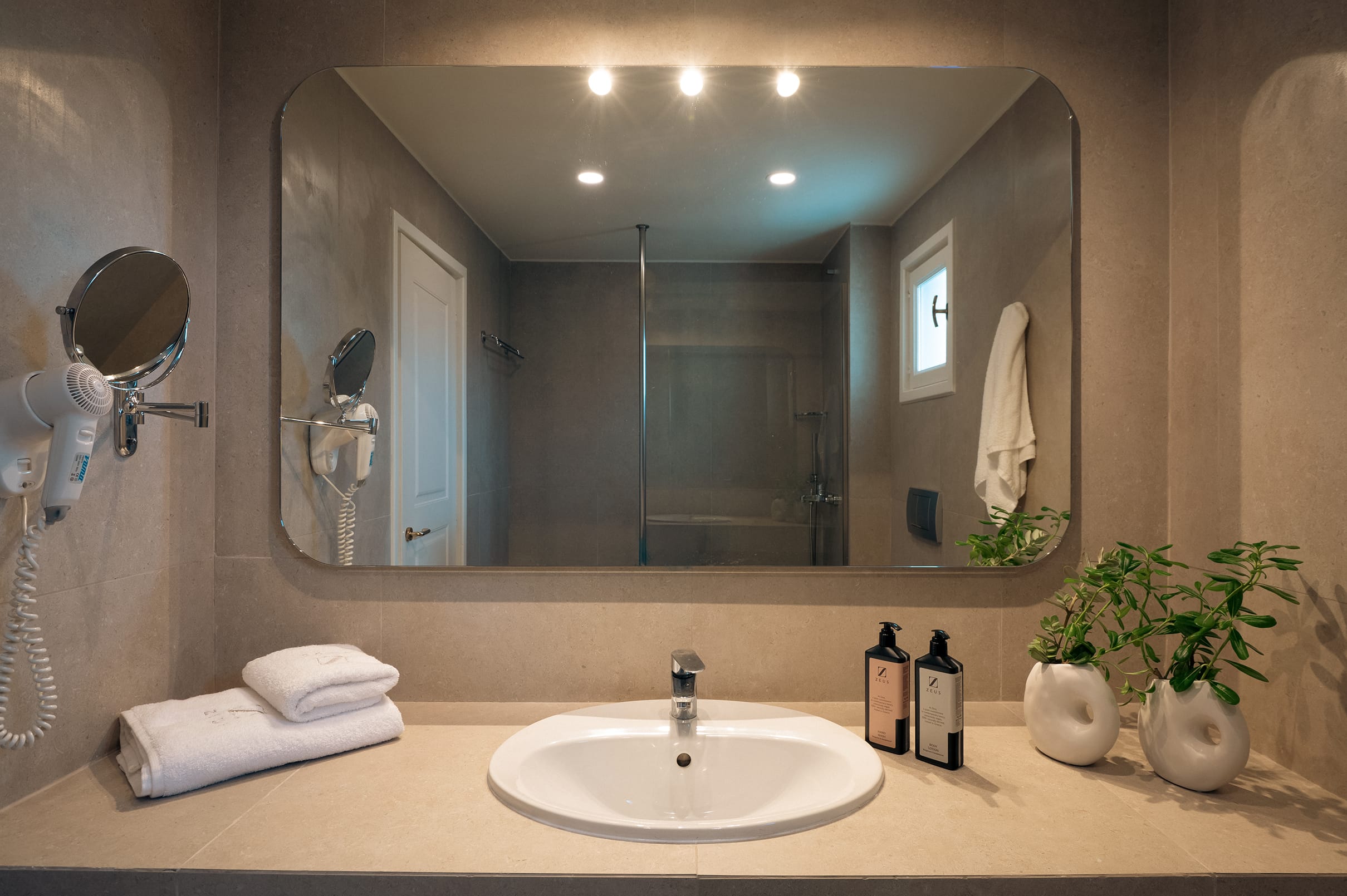 a bathroom with a large mirror