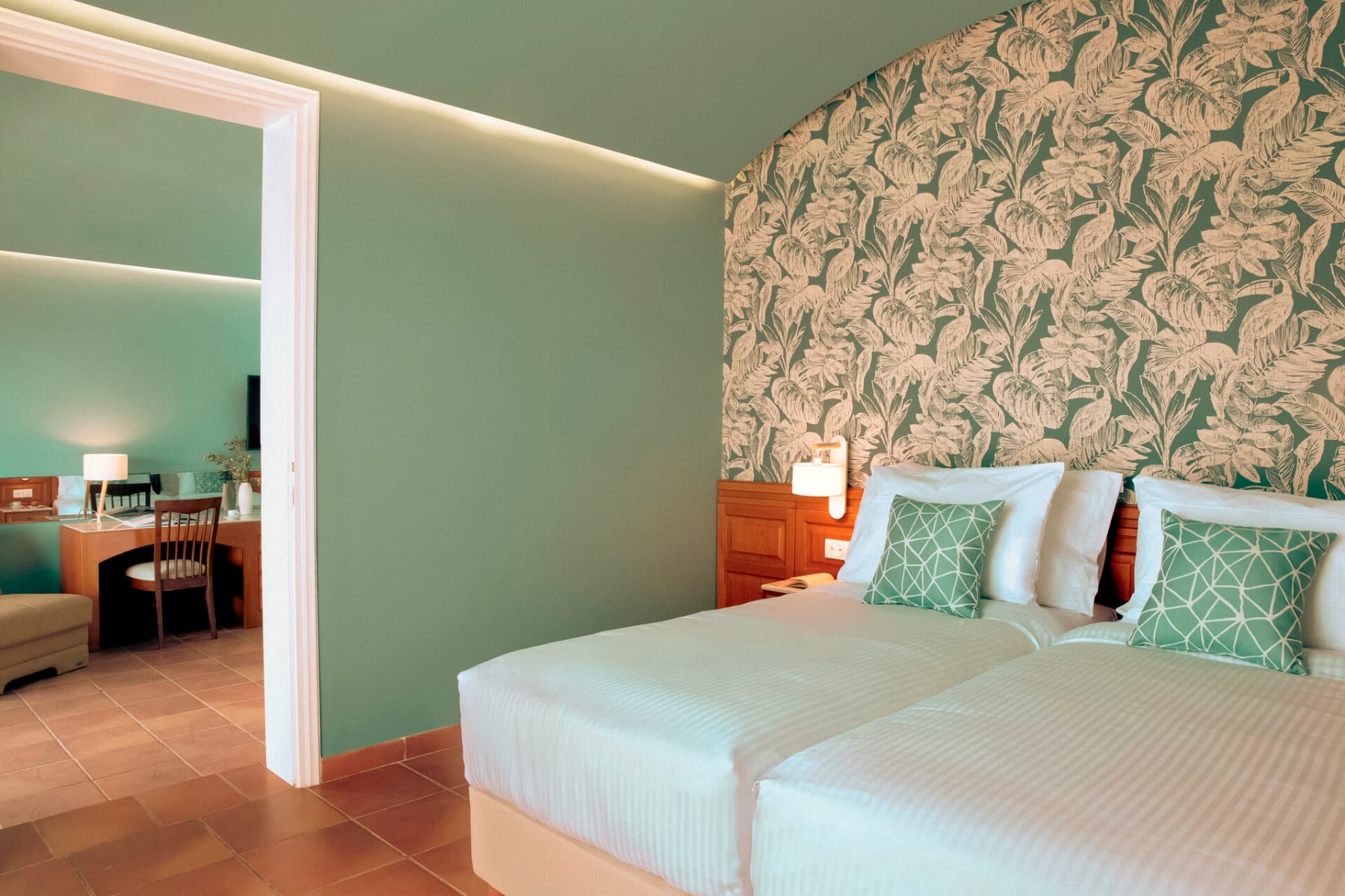 a hotel room with a bed and a desk