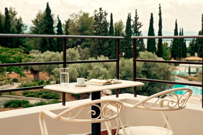a table and chairs on a balcony