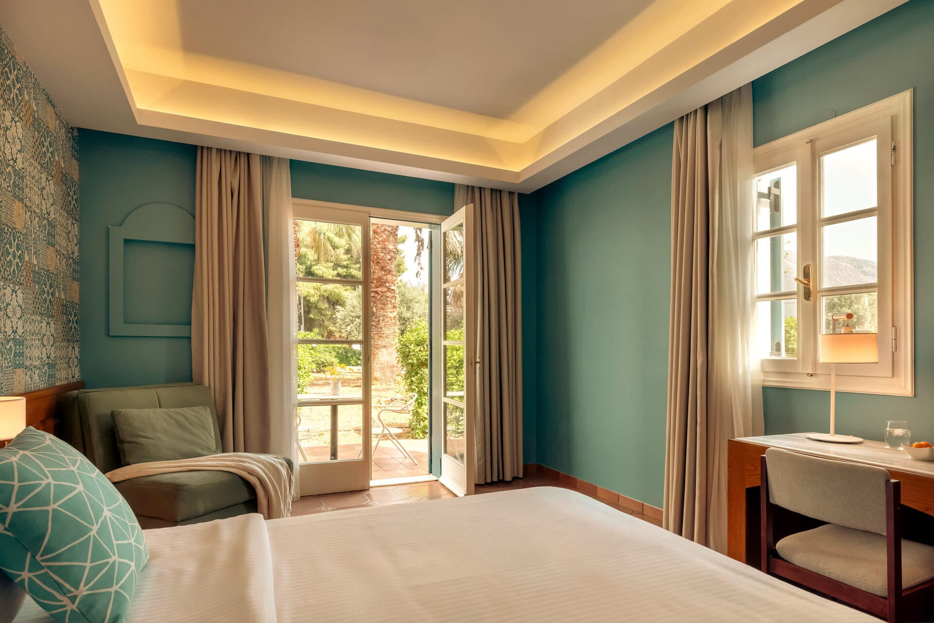 a bedroom with a bed and a chair