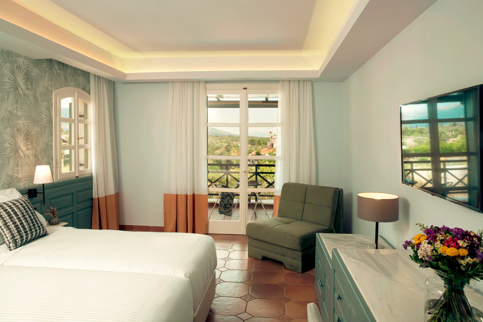 a bedroom with a bed and a couch