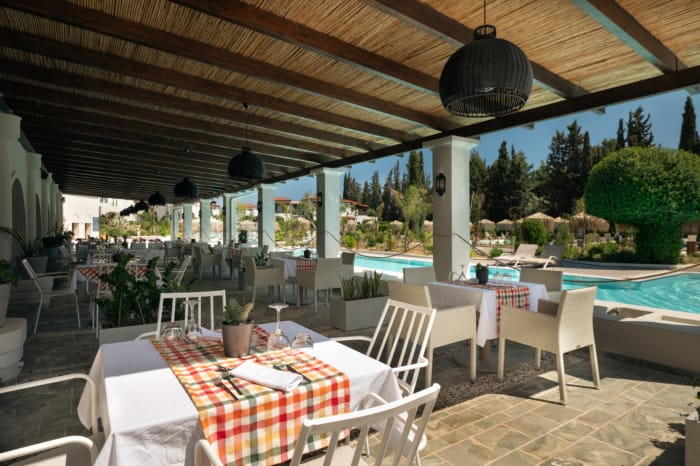 a patio with tables and chairs