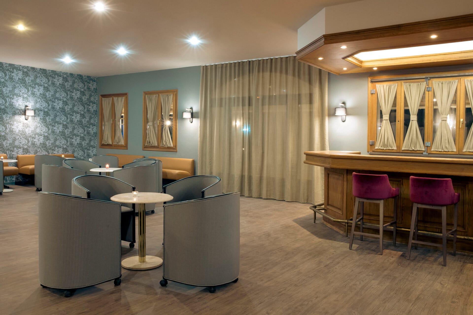 a room with a table chairs and a couch