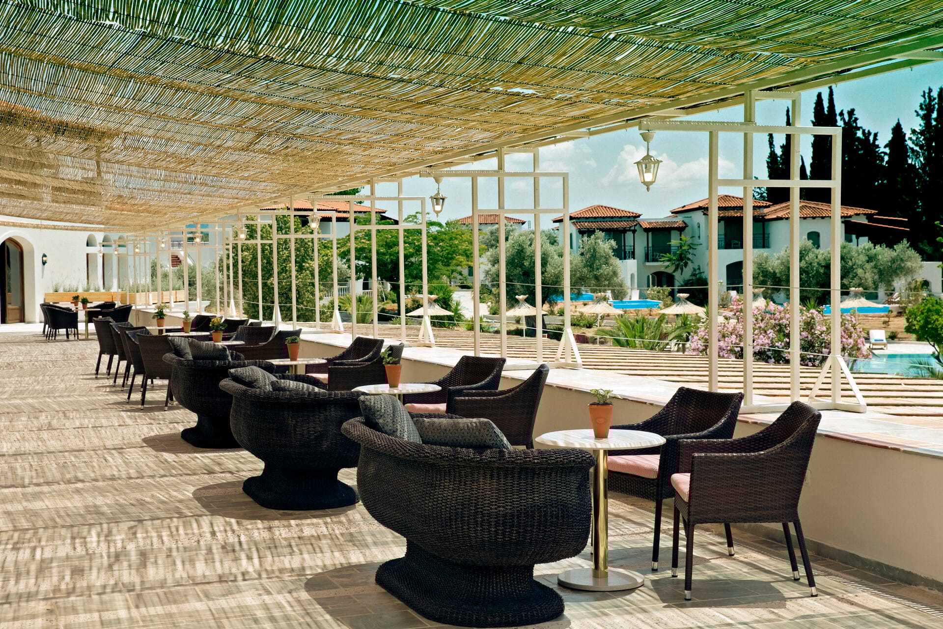 a patio with tables and chairs