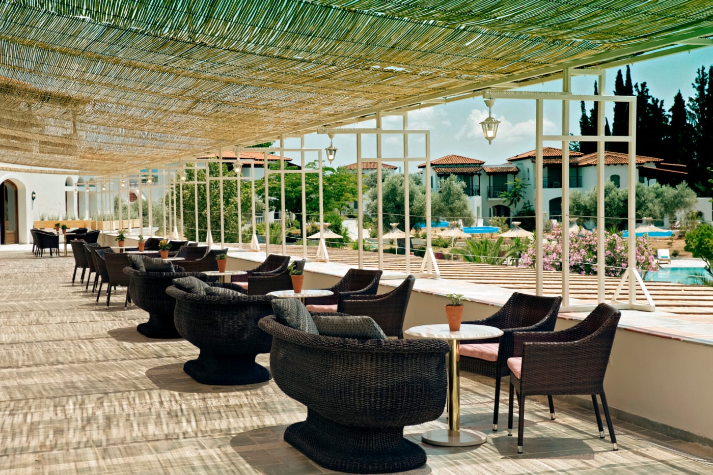 a patio with tables and chairs