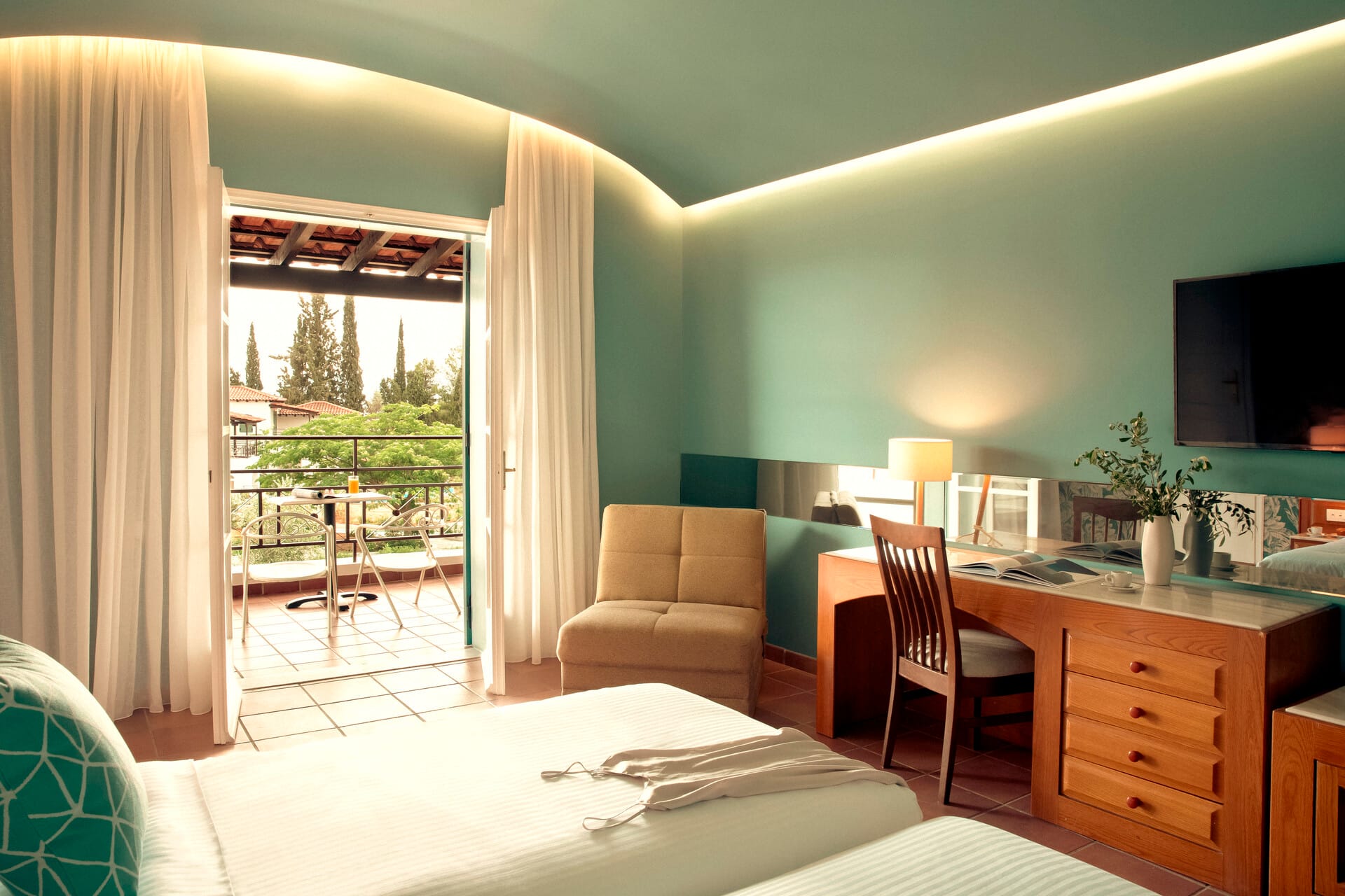 a room with a desk and chairs