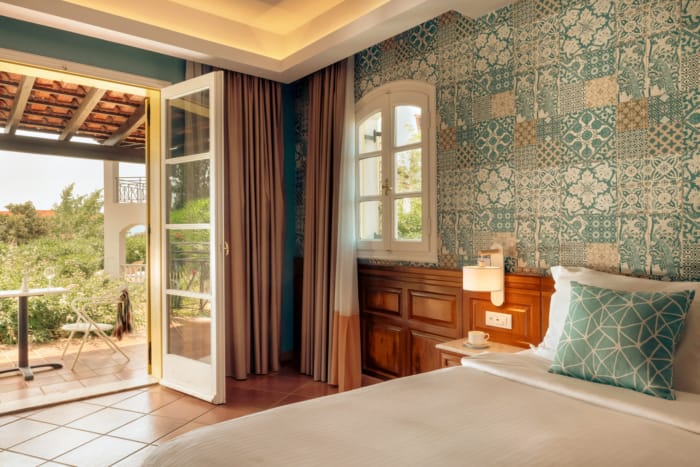 a bedroom with a large window
