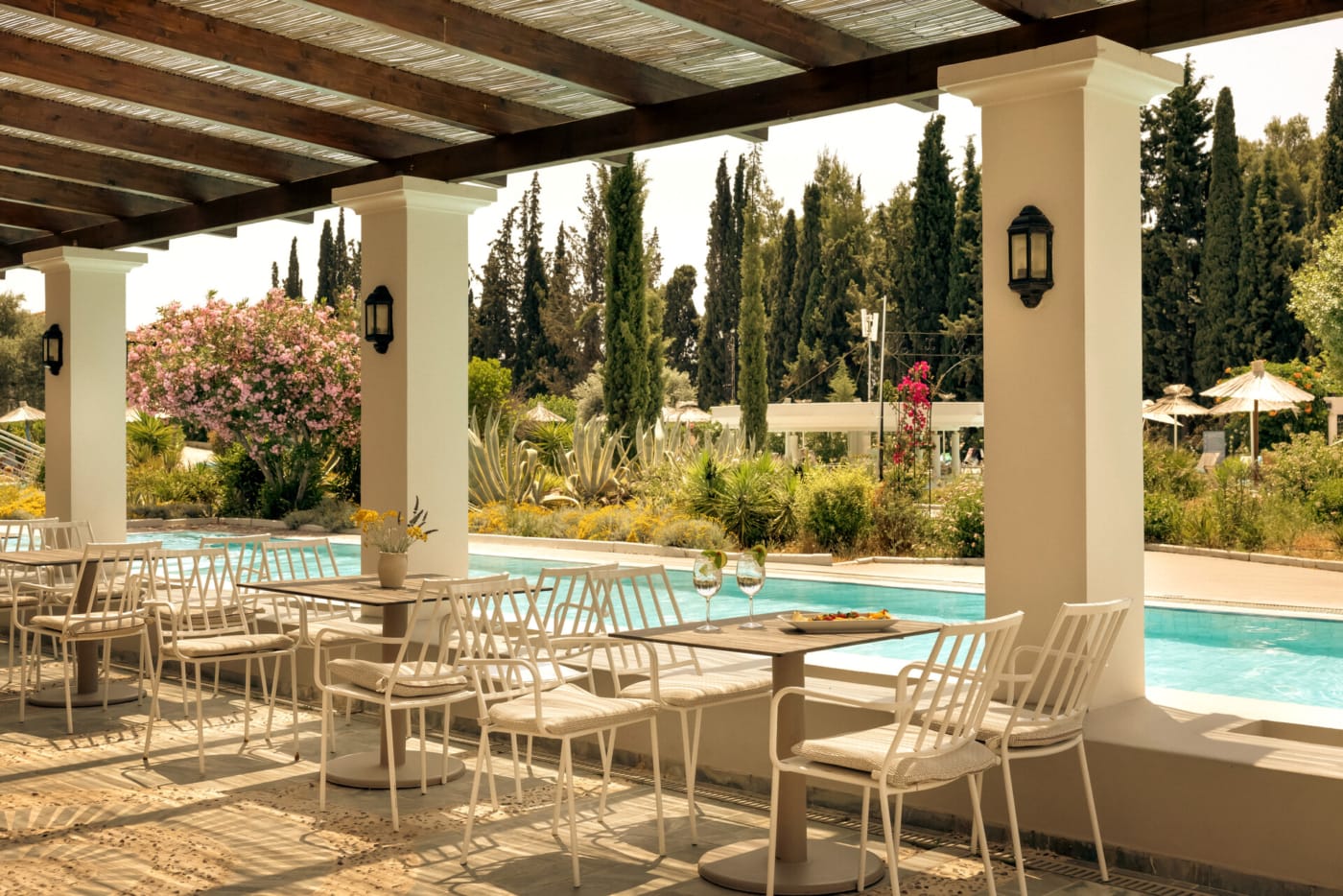 a pool with chairs around it