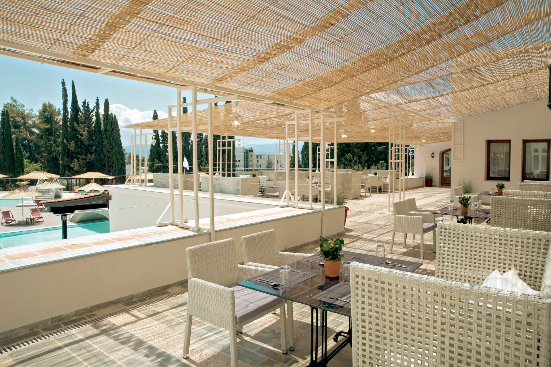 a room with a pool and chairs