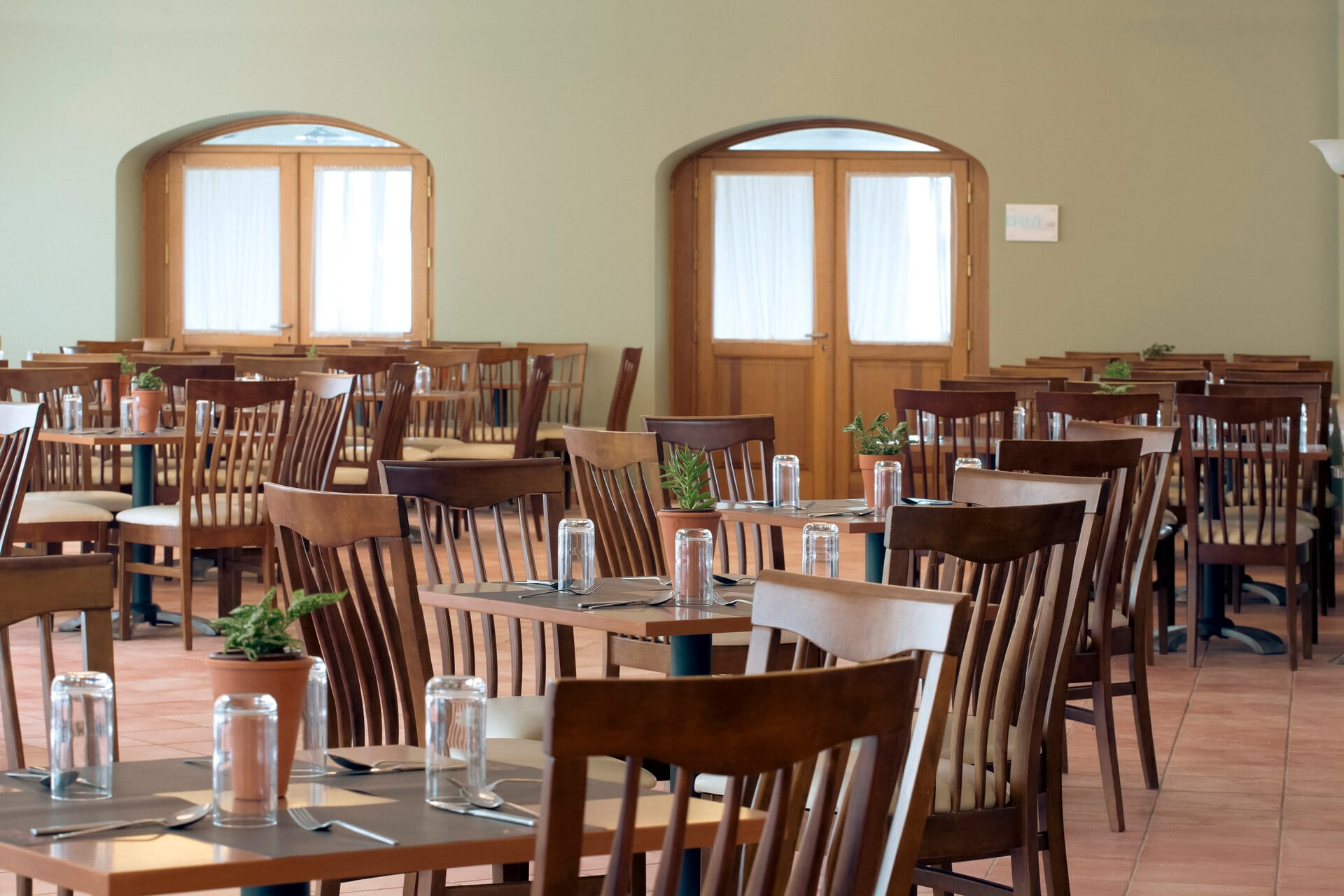 a room with tables and chairs