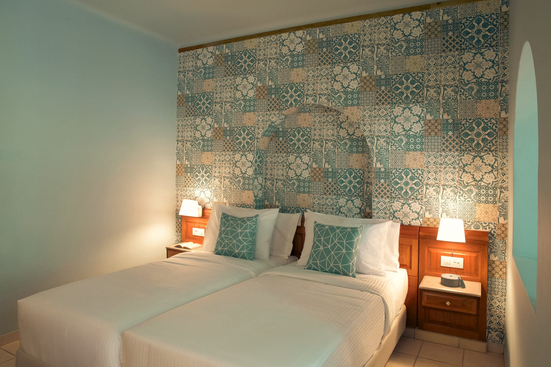 a bed with a wallpaper