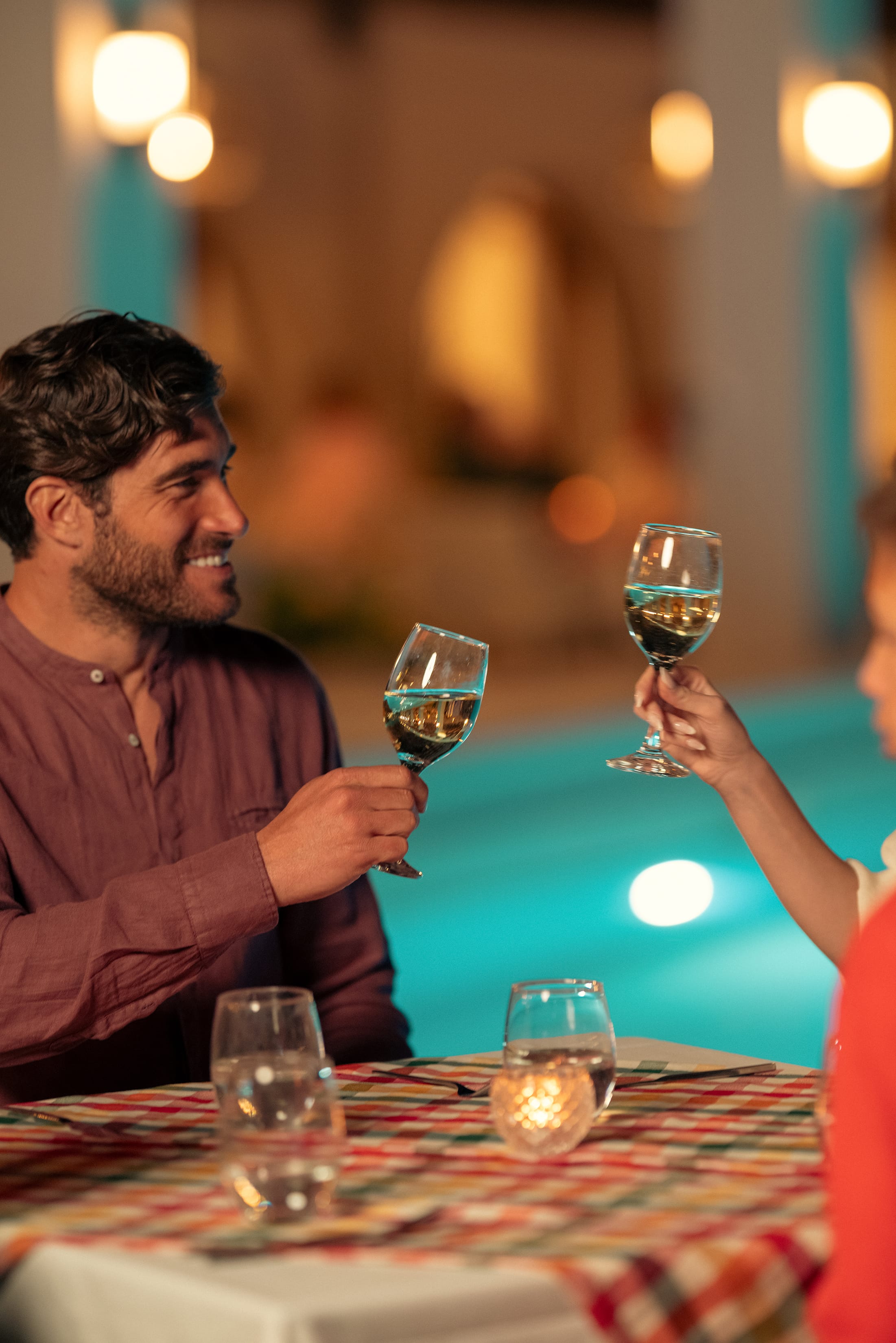 a person holding a glass of wine