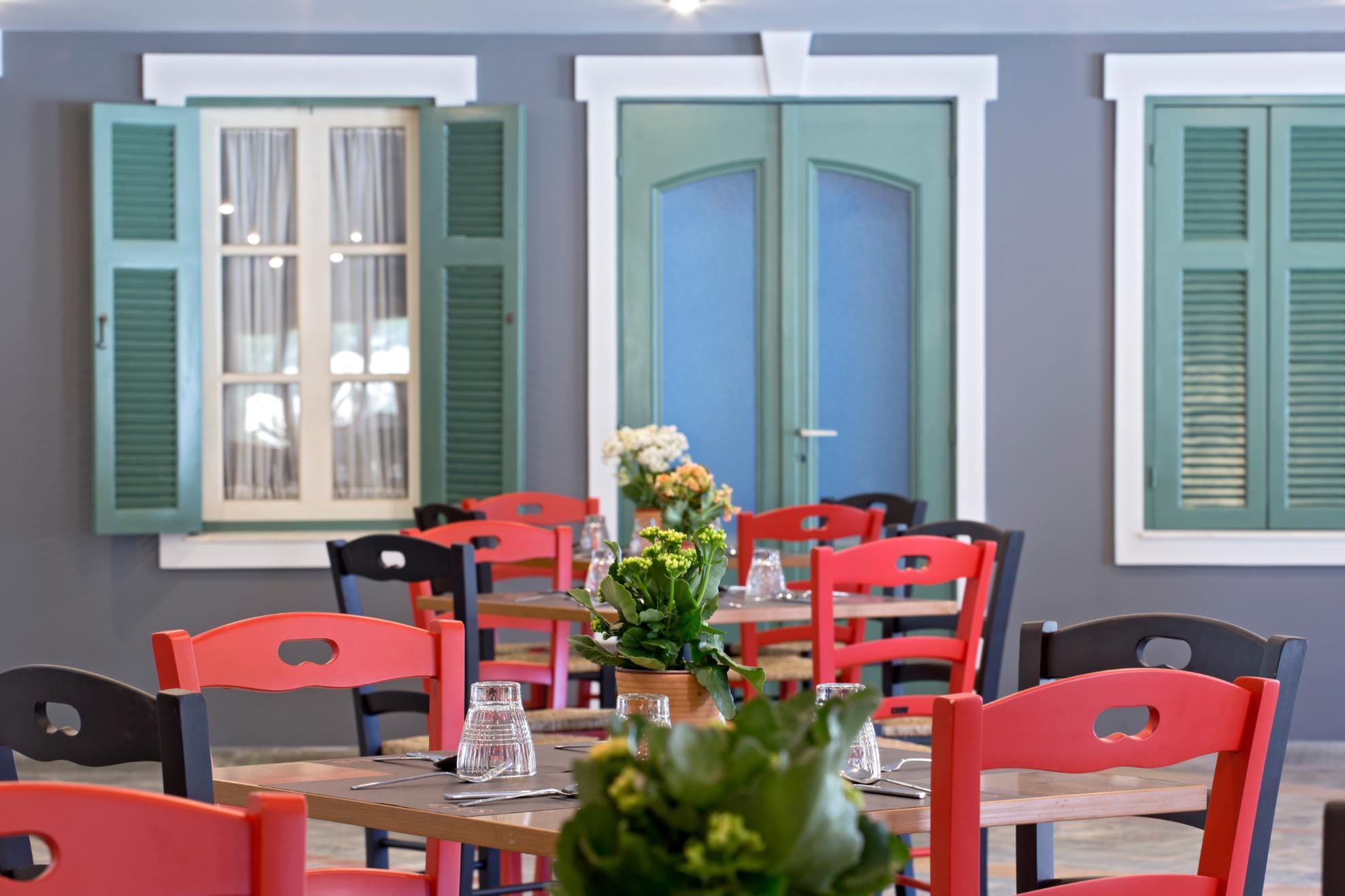 a room with tables and chairs