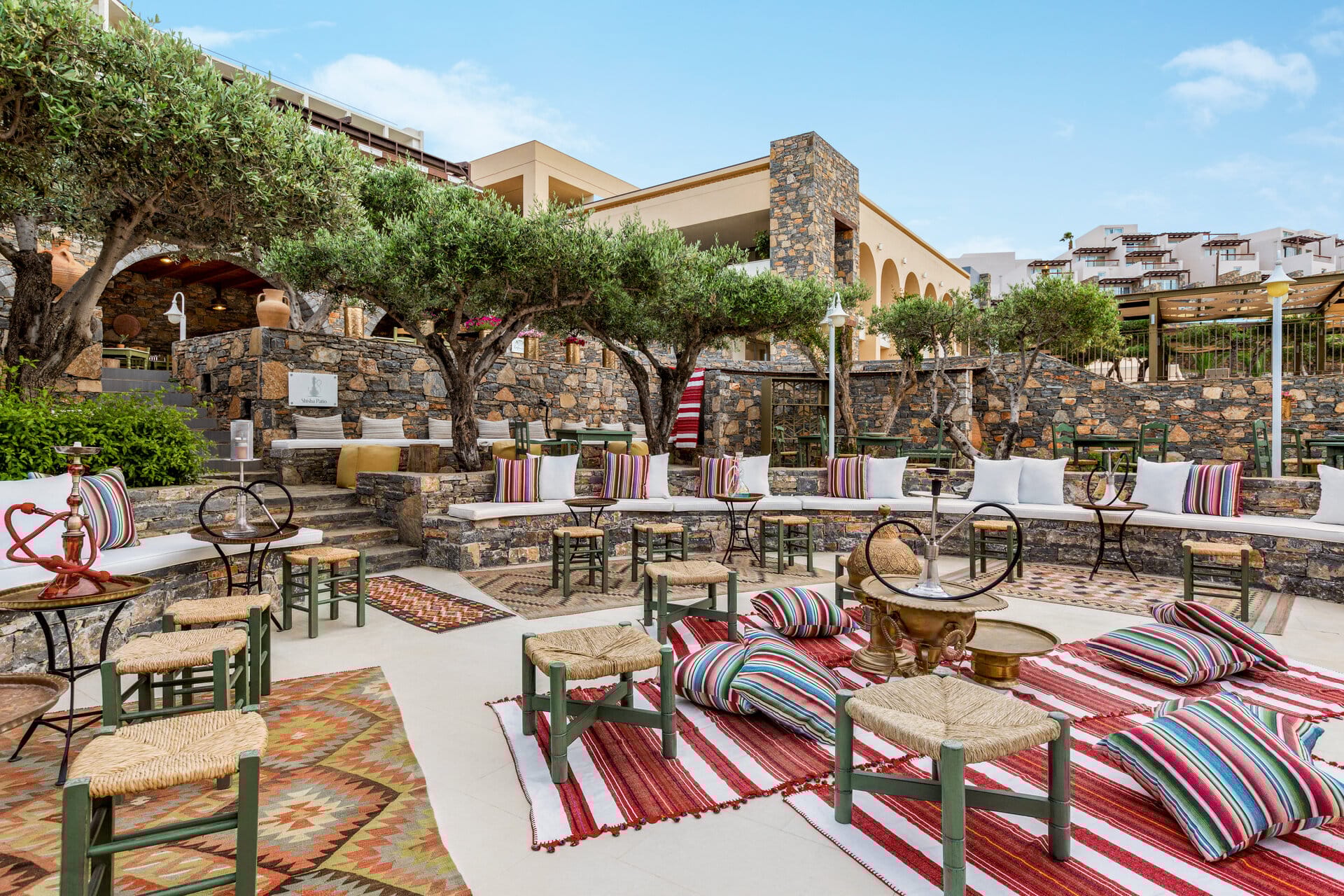 a patio with tables and chairs