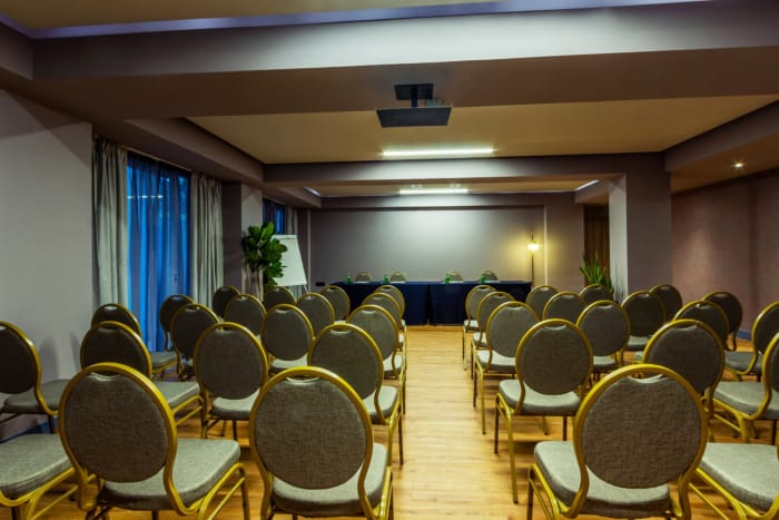a room with rows of chairs