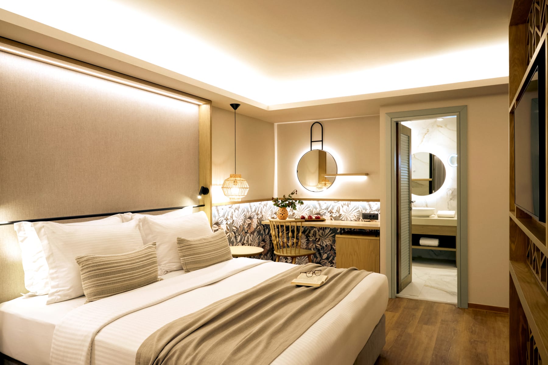 a bedroom with a bed and a mirror