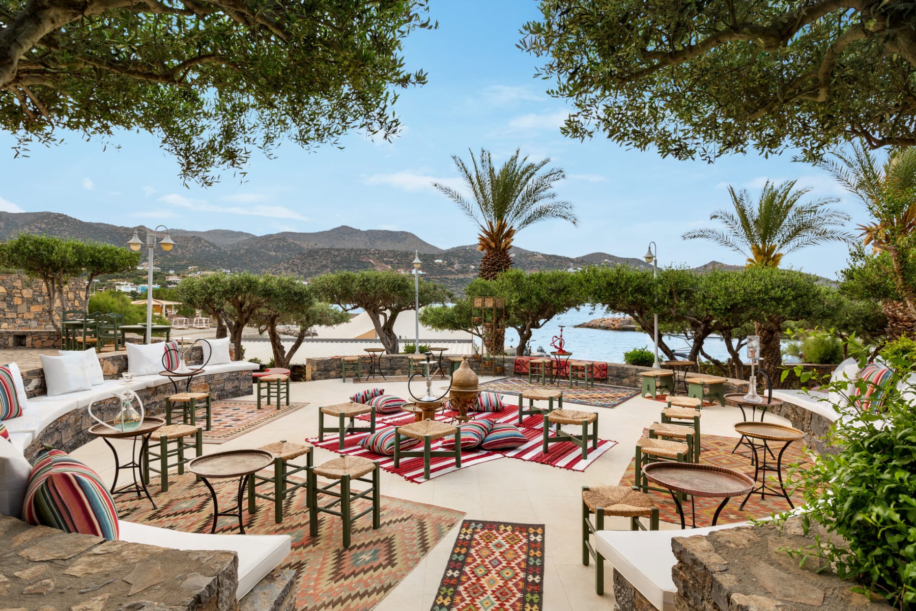 a patio with tables and chairs