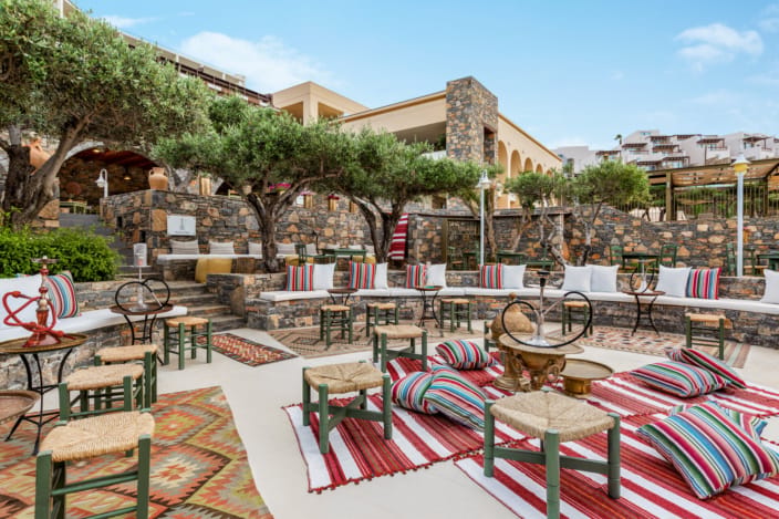 a patio with tables and chairs