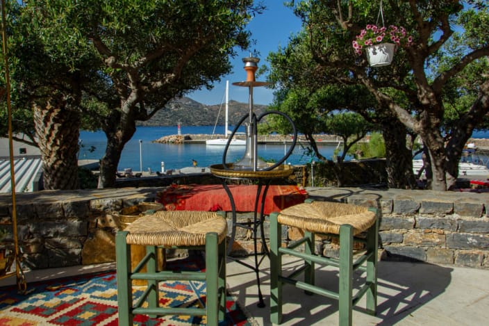 a patio with tables and chairs